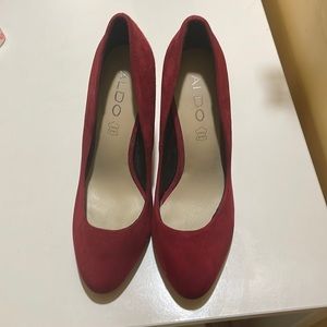 Red suede pumps